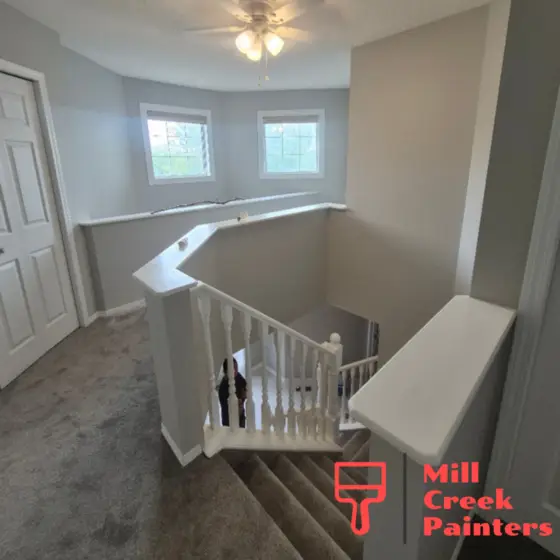 Interior house painting project completed in Citadel, Calgary featuring freshly painted walls, trim, and staircase railings.